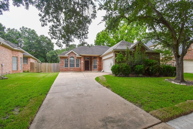 4706 Torrington Ct, Sugar Land, TX 77479 - view of front of property with brick siding, a garage, concrete driveway, and a chimney