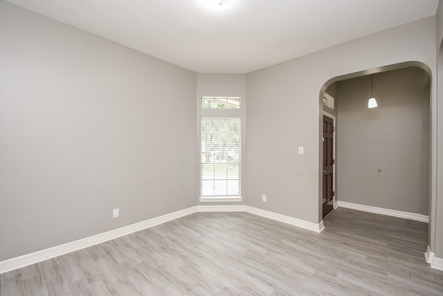 4706 Torrington Ct, Sugar Land, TX 77479 - unfurnished room featuring arched walkways and light wood-type flooring