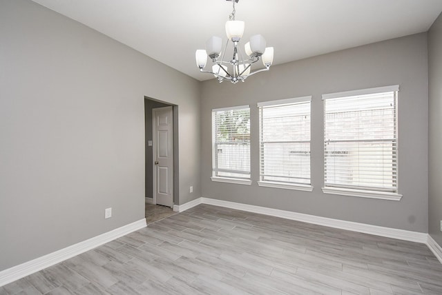 4706 Torrington Ct, Sugar Land, TX 77479 - unfurnished room with a chandelier and light wood-type flooring