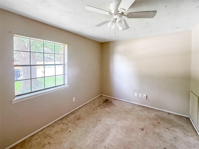 1413 Bay Ridge Blvd, Bay City, TX 77414 - empty room with a textured ceiling, carpet flooring, and ceiling fan