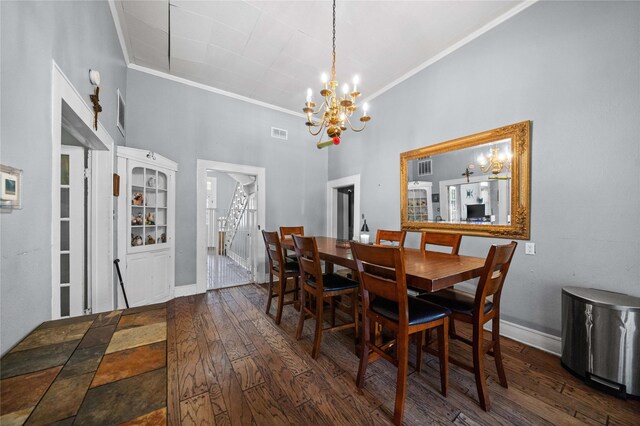 246 W 6th St, Rusk, TX 75785 - dining space featuring a chandelier, crown molding, hardwood / wood-style flooring, and a high ceiling