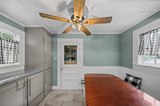 246 W 6th St, Rusk, TX 75785 - dining space with healthy amount of natural light, ornamental molding, ceiling fan, and light tile patterned flooring