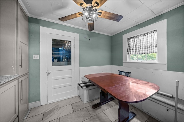 246 W 6th St, Rusk, TX 75785 - dining area featuring crown molding, a ceiling fan, and light tile patterned flooring