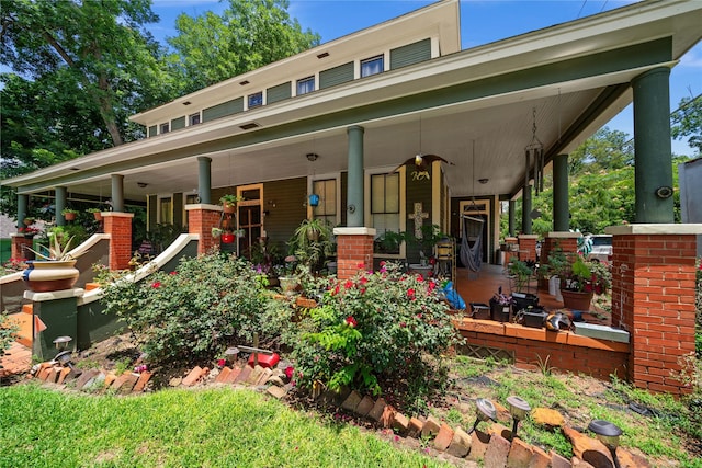 246 W 6th St, Rusk, TX 75785 - rear view of house with a porch