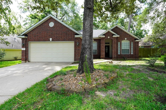 105 N Hollylaurel Cir, The Woodlands, TX 77382 - view of front facade with concrete driveway, an attached garage, and brick siding