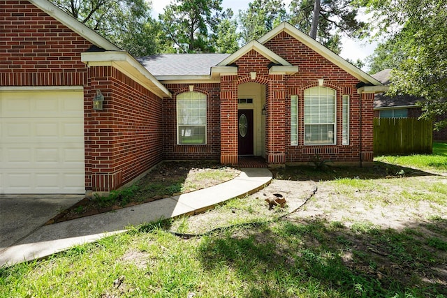 105 N Hollylaurel Cir, The Woodlands, TX 77382 - view of front of home featuring brick siding and an attached garage
