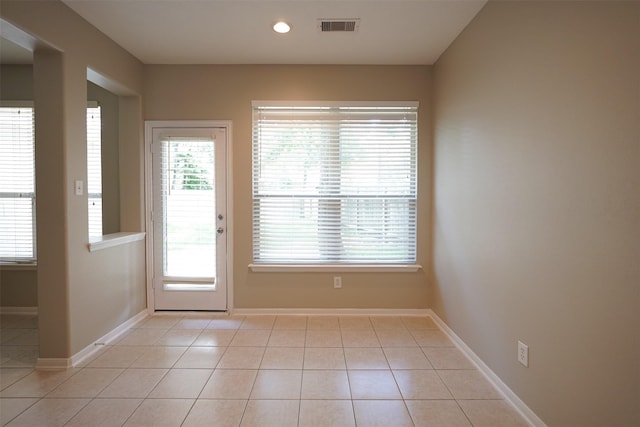 105 N Hollylaurel Cir, The Woodlands, TX 77382 - entryway with light tile patterned floors and recessed lighting