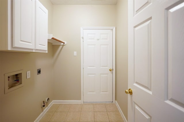 105 N Hollylaurel Cir, The Woodlands, TX 77382 - laundry area featuring cabinet space, hookup for an electric dryer, washer hookup, and light tile patterned floors