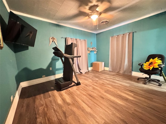918 E Mcalpine St, Navasota, TX 77868 - workout room with ornamental molding, wood finished floors, and ceiling fan