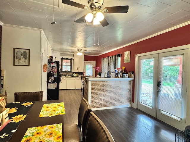 918 E Mcalpine St, Navasota, TX 77868 - dining area featuring crown molding, french doors, a ceiling fan, and dark wood-style flooring