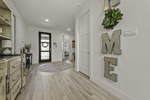 10009 Gray Jay Ct, Conroe, TX 77384 - foyer with light wood-style flooring and recessed lighting