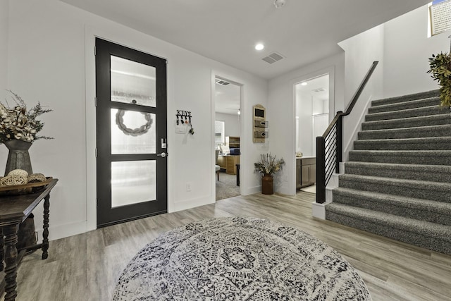 10009 Gray Jay Ct, Conroe, TX 77384 - entrance foyer with stairway, light wood-style flooring, and recessed lighting
