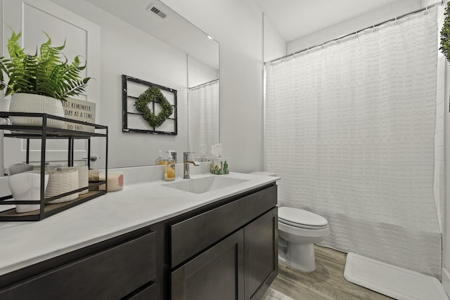 10009 Gray Jay Ct, Conroe, TX 77384 - bathroom with vanity, wood finished floors, and a shower with shower curtain