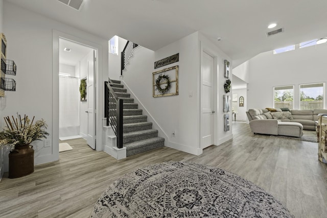 10009 Gray Jay Ct, Conroe, TX 77384 - foyer with stairway and light wood-style floors