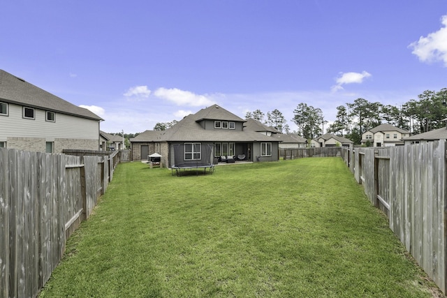 10009 Gray Jay Ct, Conroe, TX 77384 - fenced backyard with a trampoline