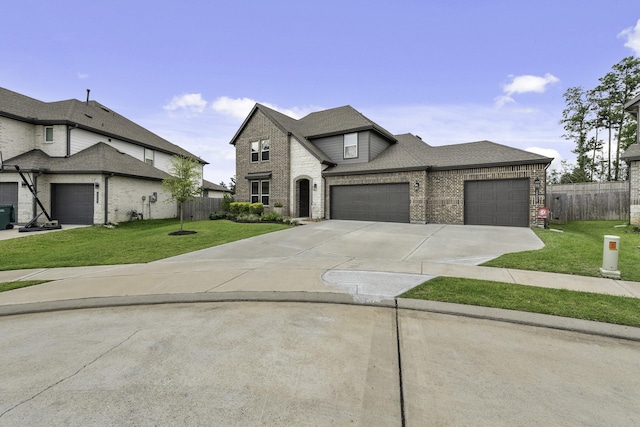 10009 Gray Jay Ct, Conroe, TX 77384 - french country home with a garage, brick siding, and driveway