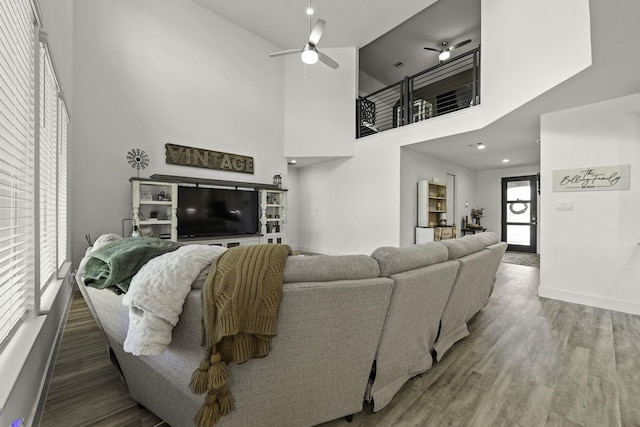 10009 Gray Jay Ct, Conroe, TX 77384 - living room with ceiling fan, a towering ceiling, and wood finished floors