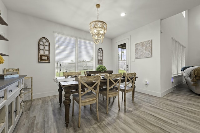 10009 Gray Jay Ct, Conroe, TX 77384 - dining area with a chandelier, light wood-style floors, and recessed lighting