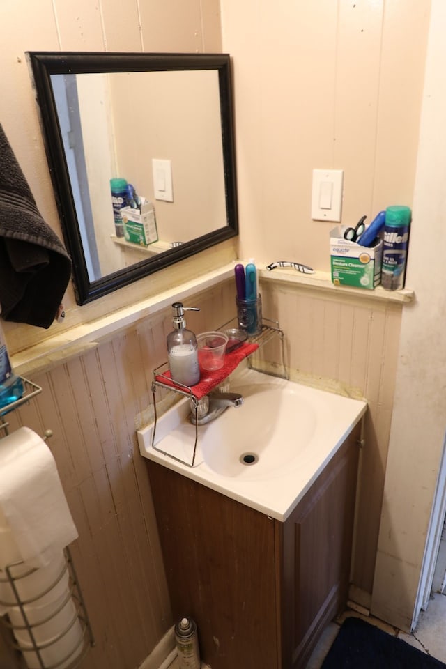 622 S Hackberry St, San Antonio, TX 78203 - bathroom featuring vanity and wooden walls