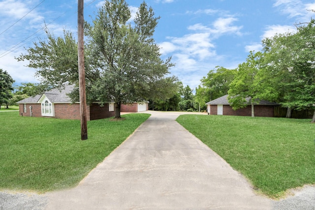 5874 Natchez Trce, Baytown, TX 77523 - view of green lawn with driveway