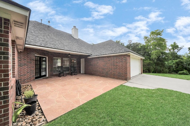 5874 Natchez Trce, Baytown, TX 77523 - view of patio / terrace featuring driveway and a garage