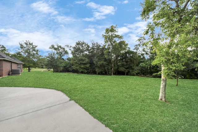 5874 Natchez Trce, Baytown, TX 77523 - view of grassy yard featuring a patio area