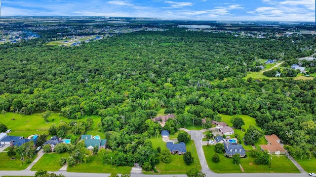 5874 Natchez Trce, Baytown, TX 77523 - aerial overview of property's location featuring a heavily wooded area