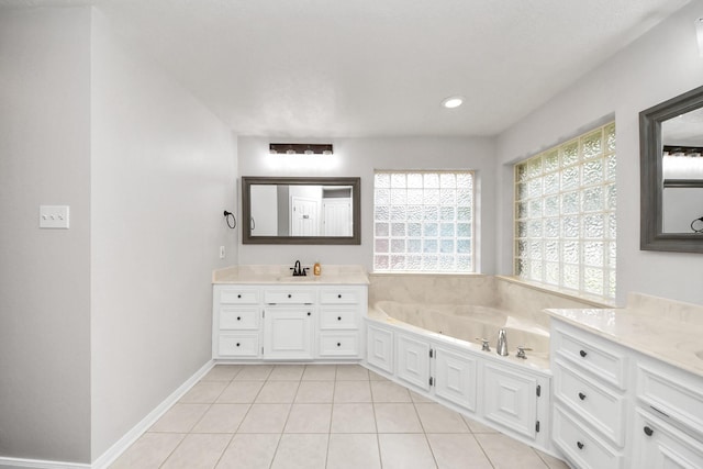 5874 Natchez Trce, Baytown, TX 77523 - bathroom with two vanities, a garden tub, tile patterned flooring, and recessed lighting