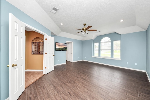 5874 Natchez Trce, Baytown, TX 77523 - unfurnished living room with ceiling fan, vaulted ceiling, dark wood finished floors, a textured ceiling, and recessed lighting
