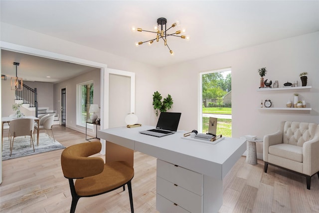 7710 Meadowvale Dr, Houston, TX 77063 - office area with a chandelier and light wood-style flooring
