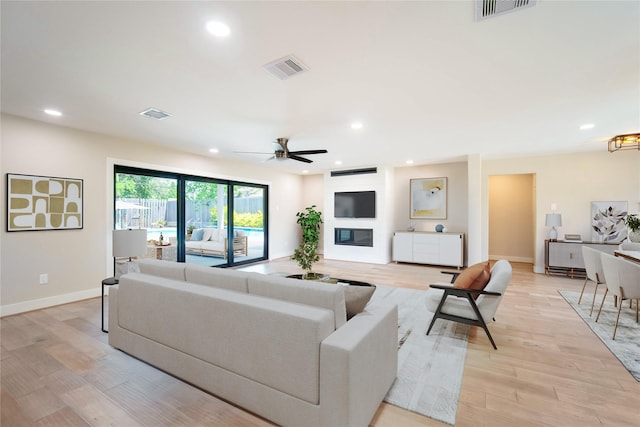7710 Meadowvale Dr, Houston, TX 77063 - living room with ceiling fan, recessed lighting, and light wood finished floors