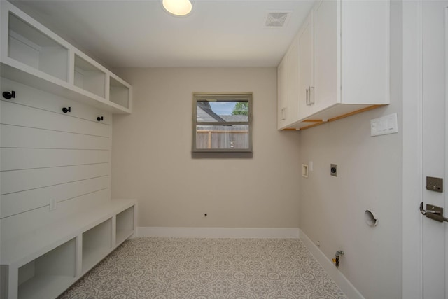 7710 Meadowvale Dr, Houston, TX 77063 - washroom featuring hookup for an electric dryer, hookup for a washing machine, hookup for a gas dryer, cabinet space, and tile patterned floors