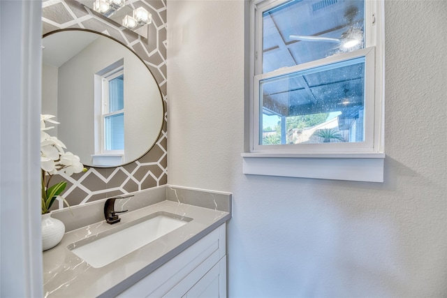 7710 Meadowvale Dr, Houston, TX 77063 - bathroom with vanity and a textured wall