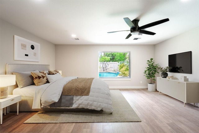 7710 Meadowvale Dr, Houston, TX 77063 - bedroom featuring wood finished floors and a ceiling fan