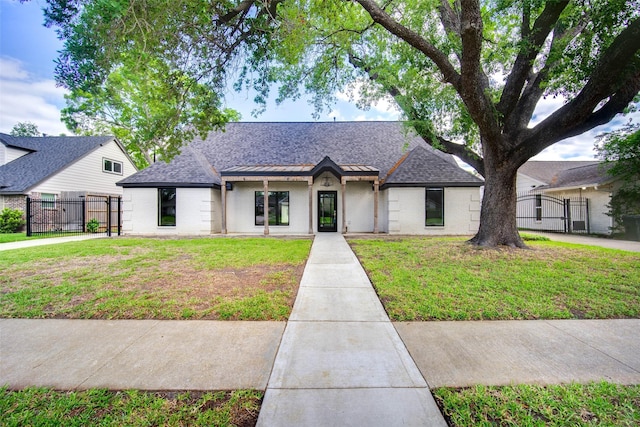 7710 Meadowvale Dr, Houston, TX 77063 - view of front of property with a gate, roof with shingles, and brick siding