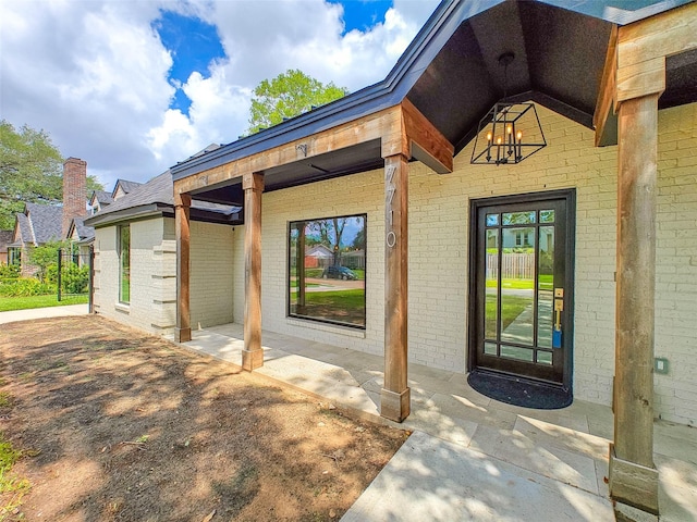 7710 Meadowvale Dr, Houston, TX 77063 - property entrance with brick siding and a patio area