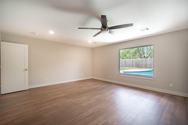 7710 Meadowvale Dr, Houston, TX 77063 - empty room with a ceiling fan, wood finished floors, and recessed lighting