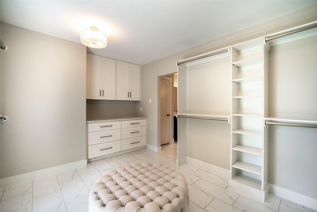 7710 Meadowvale Dr, Houston, TX 77063 - walk in closet with light marble finish flooring