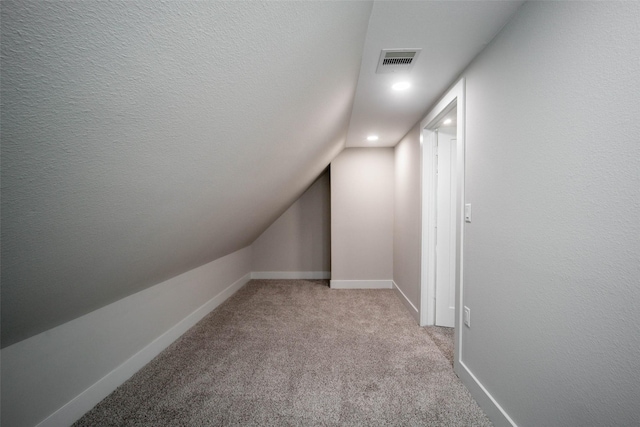 7710 Meadowvale Dr, Houston, TX 77063 - additional living space with vaulted ceiling, light colored carpet, and recessed lighting