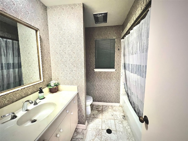 5610 Woodway Dr, Houston, TX 77056 - bathroom featuring vanity, shower / tub combo with curtain, and marble finish flooring