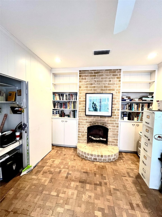 5610 Woodway Dr, Houston, TX 77056 - living room featuring a brick fireplace, built in features, and ornamental molding