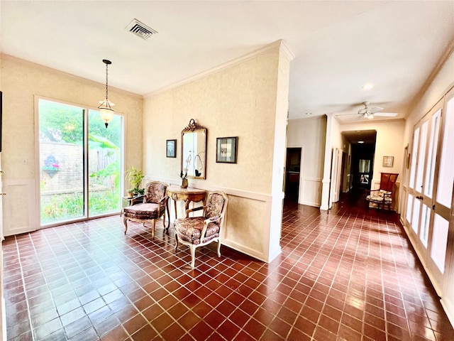 5610 Woodway Dr, Houston, TX 77056 - sitting room featuring crown molding, ceiling fan, and dark tile patterned floors