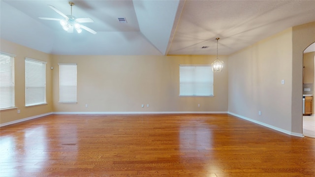 19943 Silver Rock Dr, Katy, TX 77449 - unfurnished room featuring light wood finished floors, a ceiling fan, plenty of natural light, and vaulted ceiling