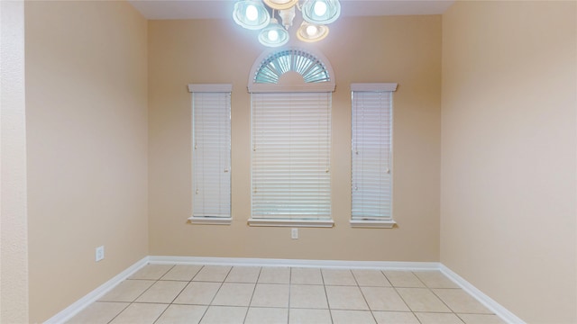 19943 Silver Rock Dr, Katy, TX 77449 - unfurnished room featuring light tile patterned floors and a chandelier