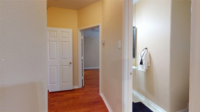 19943 Silver Rock Dr, Katy, TX 77449 - hall with wood finished floors and a textured wall