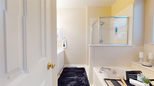 19943 Silver Rock Dr, Katy, TX 77449 - full bathroom with a shower stall, vanity, and a garden tub
