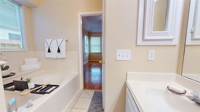 19943 Silver Rock Dr, Katy, TX 77449 - full bath featuring vanity, a garden tub, and tile patterned floors