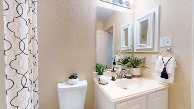 19943 Silver Rock Dr, Katy, TX 77449 - full bathroom featuring vanity, a textured wall, and a shower with curtain