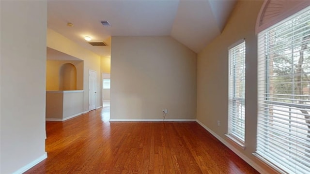 19943 Silver Rock Dr, Katy, TX 77449 - unfurnished room featuring healthy amount of natural light, wood finished floors, and vaulted ceiling