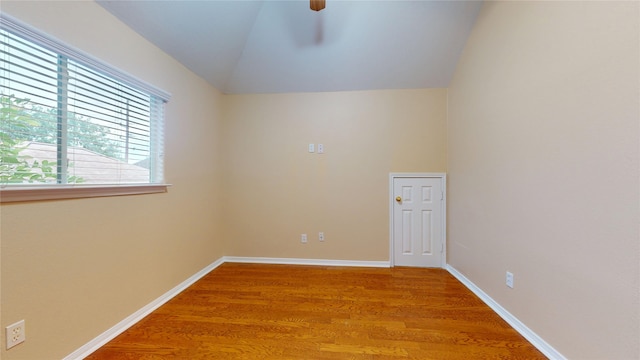 19943 Silver Rock Dr, Katy, TX 77449 - empty room featuring lofted ceiling, light wood-type flooring, and a ceiling fan